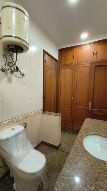 Bathroom in 3 BHK Apartment at Florence Nightingale Lane, Green Park – for Rent
