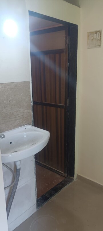 Bathroom in 1 BHK Apartment at Vantage Green Woods, Shilphata – for Rent
