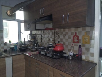 Kitchen in 2 BHK Apartment at Mahagun Mywoods III, Sector 16c Greater Noida – for Rent