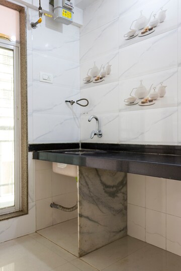 Kitchen in 1 BHK Apartment at Pragati Crystal, Ulwe Sector 21 – for Sale
