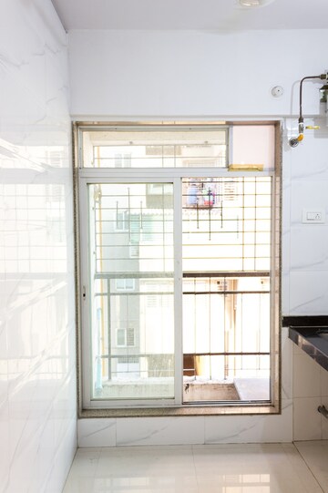 Kitchen in 1 BHK Apartment at Pragati Crystal, Ulwe Sector 21 – for Sale