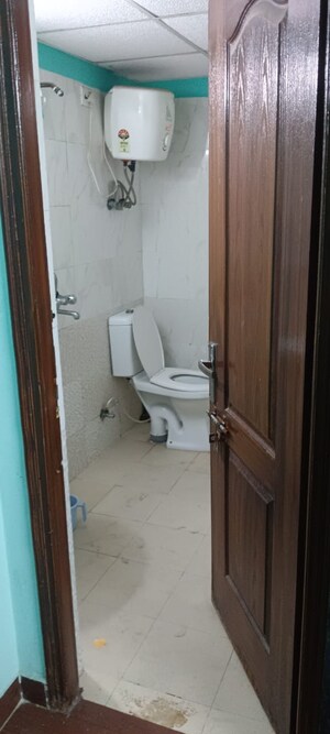 Bathroom in 2 BHK Apartment at Aims Golf City, Sector 75 – for Sale