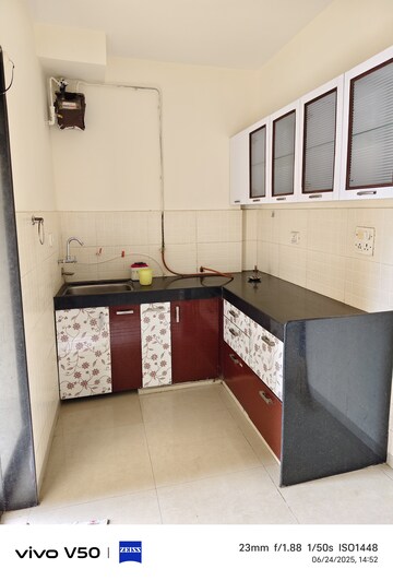 Kitchen in 2 BHK Apartment at Lalani Residency, Kavesar – for Sale