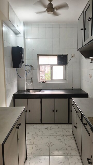 Kitchen in 2 BHK Apartment at Ajmera Arham, Malad West – for Rent