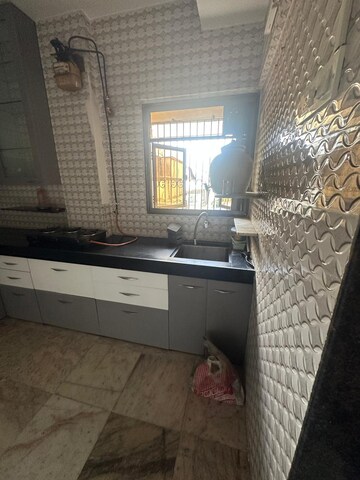 Kitchen in 2 BHK Apartment at Orlem Grace Apartments, Malad West – for Rent