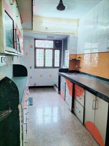 Kitchen in 2 BHK Apartment at Arpan Darpan CHS, Goregaon East – for Rent
