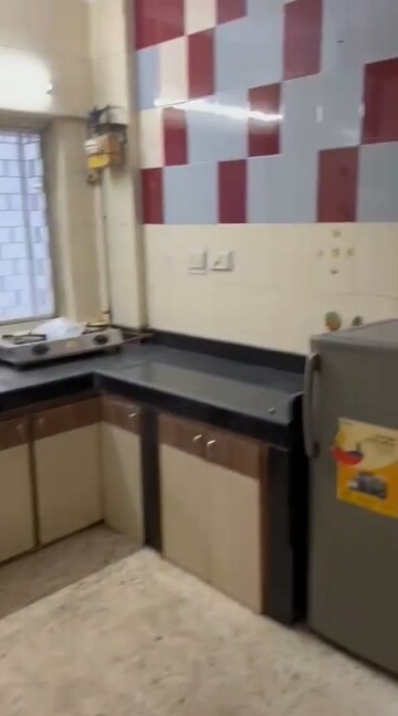 Kitchen in 1 BHK Apartment at Cosmos CHS, Andheri West – for Rent