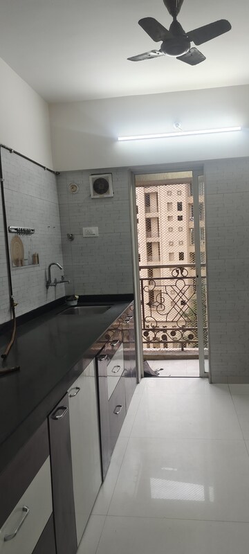 Kitchen in 2.5 BHK Apartment at Rosa Oasis, Ghodbunder Road – for Rent