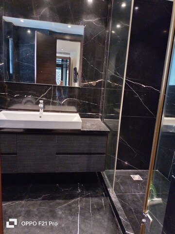 Bathroom in 4 BHK Apartment at Vasant Vihar – for Rent