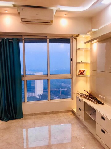 Living Room in 1 BHK Apartment at Lodha Amara, Kolshet Road – for Rent