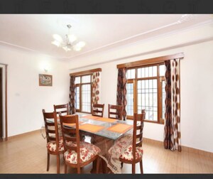 Living Room in 4 BHK Apartment at Vikasnagar – for Sale