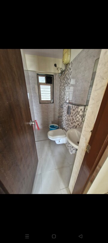 Bathroom in 2 BHK Apartment at Kamal Apartment Teen Hath Naka, Louis Wadi – for Rent