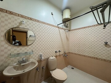 Bathroom in 3 BHK Apartment at Defence Colony – for Rent