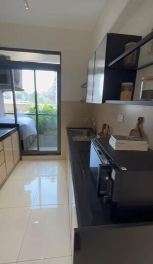 Kitchen in 3 BHK Apartment at Godrej Exquisite, Ghodbunder Road – for Sale