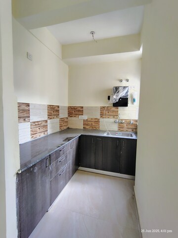 Kitchen in 2 BHK Apartment at Amrapali Enchante, Tech Zone 4 Greater Noida – for Sale