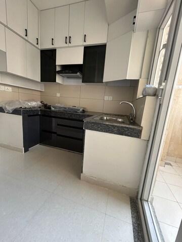 Kitchen in 2 BHK Apartment at Tata Eureka Park, Sector 150 – for Rent