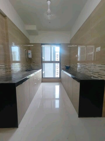 Kitchen in 2 BHK Apartment at Raj Infinia, Malad West – for Sale