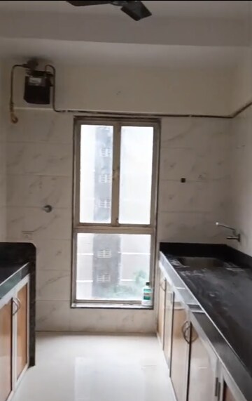 Kitchen in 2 BHK Apartment at Dharti Presidio, Malad West – for Rent