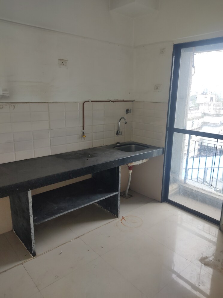 Kitchen, man-opus 2 Bedroom 692 Sq.Ft. Apartment In Mira Road Thane 8871329