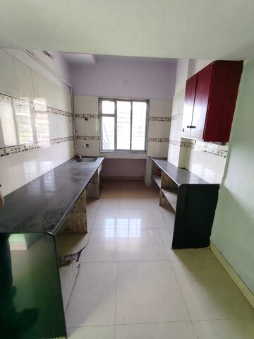 Kitchen in 2 BHK Apartment at Osho Dhara Greens, Khadakpada – for Rent
