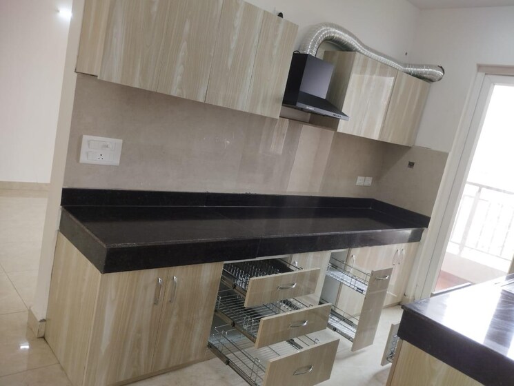 Kitchen, urban-axis-urban-woods 2 Bedroom 867 Sq.Ft. Apartment In Sushant Golf City Lucknow 8872781