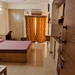 Living Room in 1 RK Apartment at Supertech Eco Suites, Sector 137 – for Rent