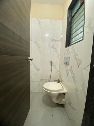 Bathroom in 1 BHK Apartment at Dosti Desire, Brahmand – for Sale