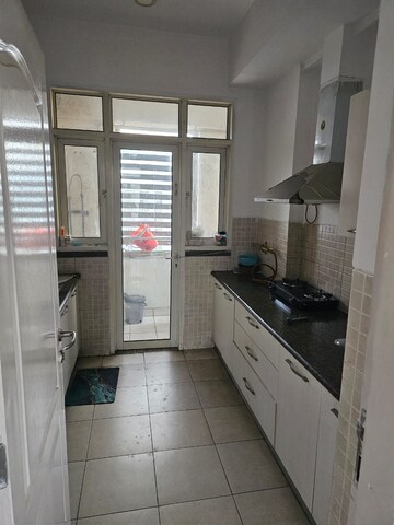 Kitchen in 2 BHK Apartment at Aims Golf Avenue II, Sector 75 – for Rent