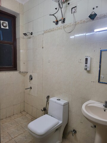 Bathroom in 3 BHK Builder Floor at DLF Atria, Dlf Phase ii – for Rent