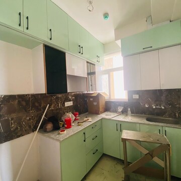 Kitchen in 3 BHK Apartment at Amrapali Riverview, Amrapali Leisure Valley – for Rent