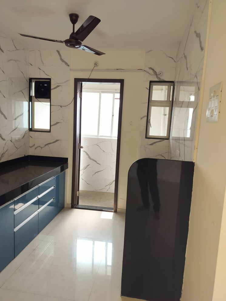 Kitchen, blue-27th-avenue 2 Bedroom 800 Sq.Ft. Apartment In Bavdhan Pune 8876257
