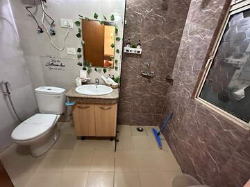 Bathroom in Studio Apartment at Nimbus The Golden Palm, Sector 168 – for Sale