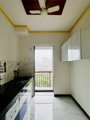 Kitchen in 1 BHK Apartment at Man Opus, Mira Road – for Sale