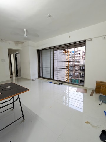 Living Room in 2 BHK Apartment at Acme Avenue, Kandivali West – for Rent