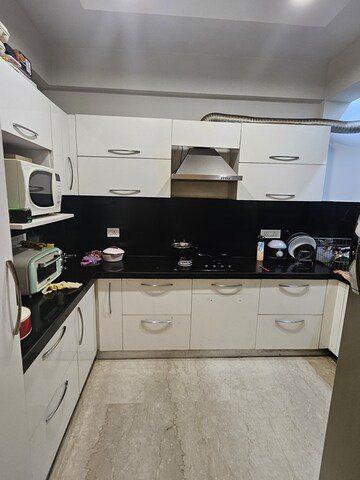 Kitchen in 4 BHK Apartment at Adani M2K Oyster Grande, Sector 102 – for Rent