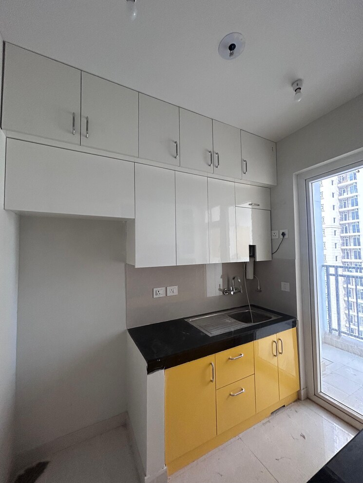 Kitchen, eldeco-live-by-the-greens 2 Bedroom 676 Sq.Ft. Apartment In Sector 150 Noida 8879881