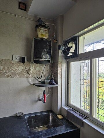 Kitchen in 2 BHK Apartment at Sahayog Complex, Manpada – for Rent