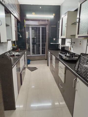 Kitchen in 2 BHK Apartment at The Wadhwa Palm Beach Residency, Nerul Sector 4 – for Rent