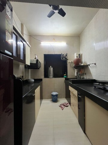 Kitchen in 2 BHK Apartment at Ulhasnagar – for Sale