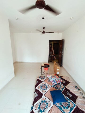 Living Room in 1 BHK Apartment at Parinee Essence, Kandivali West – for Rent