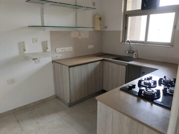Kitchen in 2 BHK Apartment at Hiranandani Estate Rodas Enclave, Ghodbunder Road – for Rent