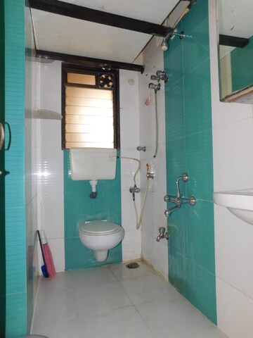 Bathroom in 1 BHK Apartment at Aman Spring, Kandivali West – for Rent