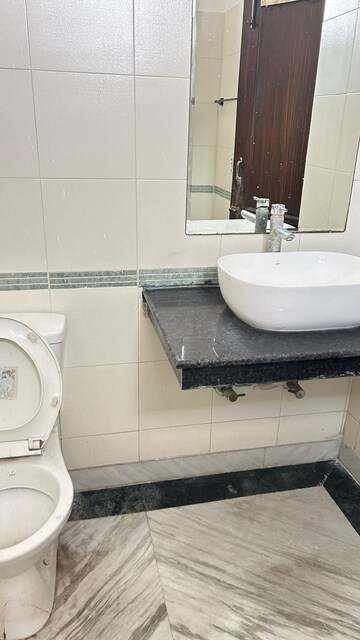 Bathroom in 3 BHK Apartment at RWA Apartments, Sector 31 – for Rent