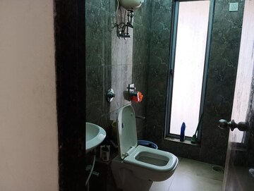 Bathroom in 3 BHK Apartment at Shakti Enclave Phase 2, Malad West – for Rent
