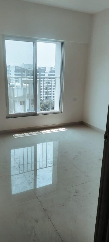 Room in 2 BHK Apartment at Windwards CHS, Wakad – for Rent