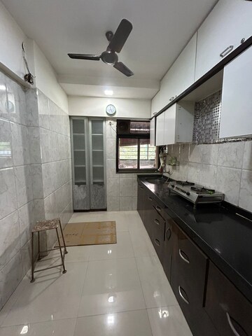 Kitchen in 2 BHK Apartment at Cosmos Empress Park, Ghodbunder Road – for Rent