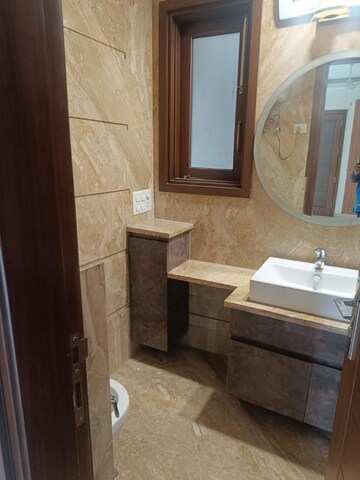 Bathroom in 4 BHK Builder Floor at Florence Nightingale Lane, Green Park Extension – for Rent
