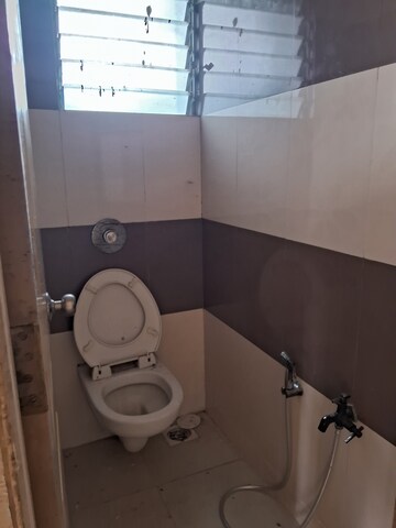 Bathroom in 1 BHK Apartment at New Krishna Tower, Kopar Khairane – for Rent