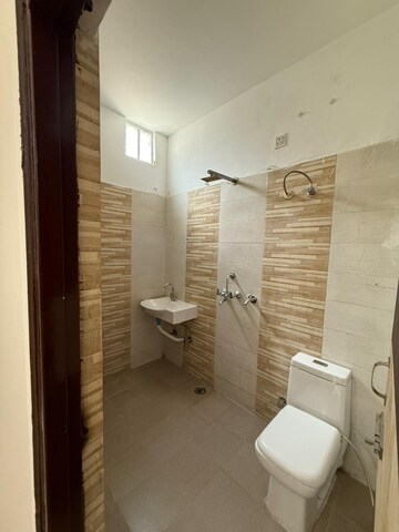 Bathroom in 2 BHK Apartment at Dhakoli – for Sale