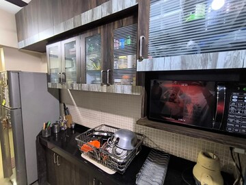 Kitchen in 2 BHK Apartment at Sudarshan Sky Garden, Ghodbunder Road – for Sale